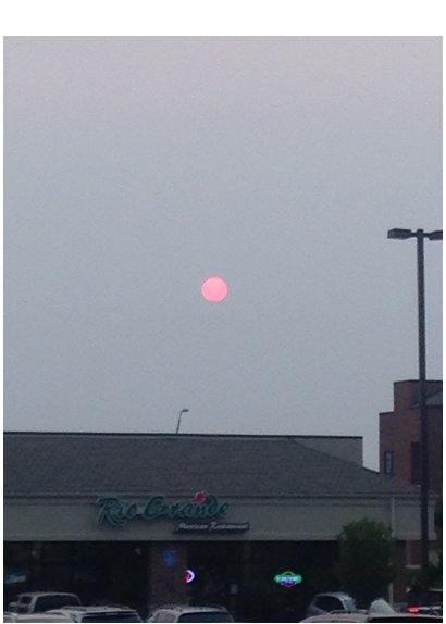 Sun obscured by wildfire smoke from Alberta, Canada. Columbia, MO, 8:04 p.m. CDT, June 28, 2015. Photo: Pat Guinan