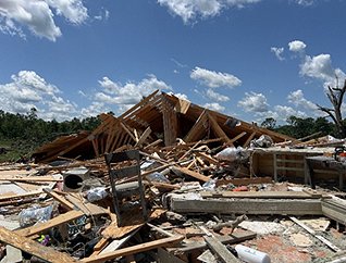 Figure 2: Damaged home in Howell County after the May 26 EF-3 tornado. (Photo courtesy of Springfield, MO NWS Office)